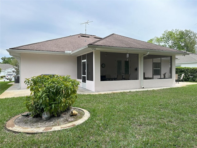 rear view of property with a yard