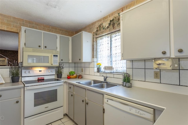 13 Washington Pl, Palm Coast, FL 32164 - kitchen with a sink, tasteful backsplash, white appliances, and light countertops