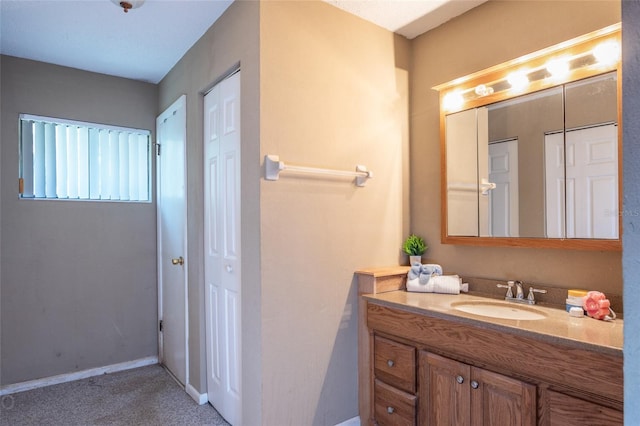 13 Washington Pl, Palm Coast, FL 32164 - bathroom featuring baseboards and vanity