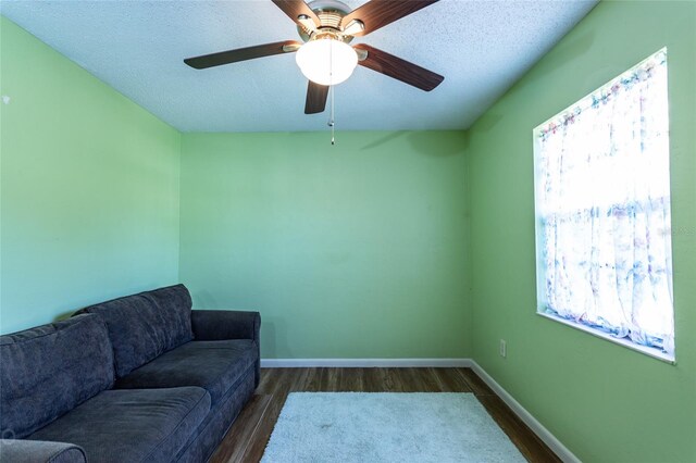 13 Washington Pl, Palm Coast, FL 32164 - living area with baseboards, ceiling fan, a textured ceiling, and wood finished floors