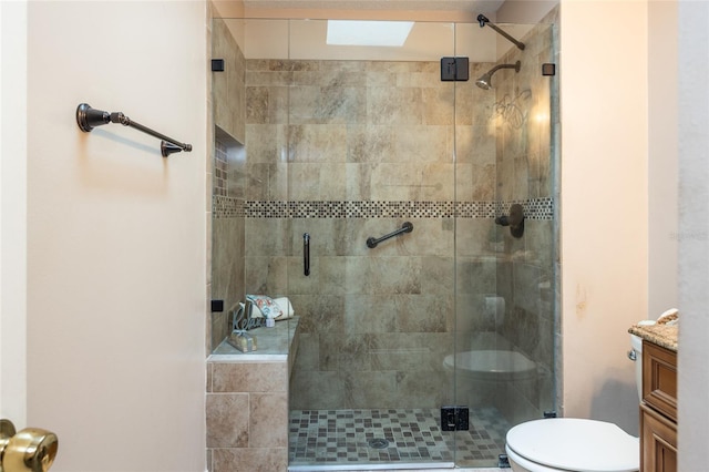 bathroom with vanity, toilet, and walk in shower