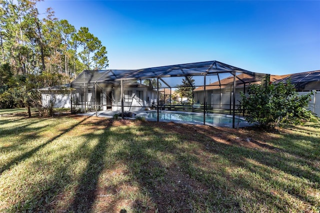 13 Washington Pl, Palm Coast, FL 32164 - rear view of property featuring a lawn and an outdoor pool