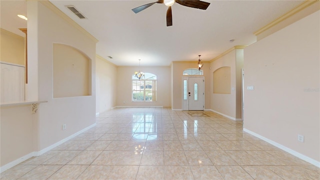 tiled entrance foyer with crown molding and ceiling fan with notable chandelier