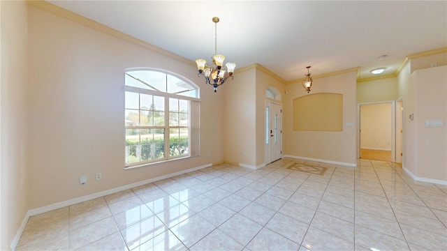 tiled spare room with an inviting chandelier and crown molding