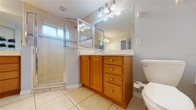 bathroom with vanity, toilet, a shower with shower door, and tile patterned flooring