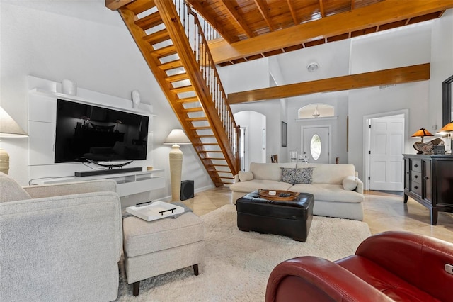 living room with beam ceiling, high vaulted ceiling, and light tile patterned floors