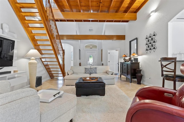 tiled living room featuring a towering ceiling, wooden ceiling, and beamed ceiling