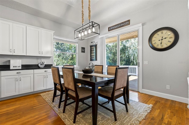 dining space with hardwood / wood-style flooring and a wealth of natural light