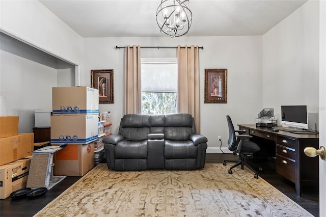 office area with an inviting chandelier and dark hardwood / wood-style flooring