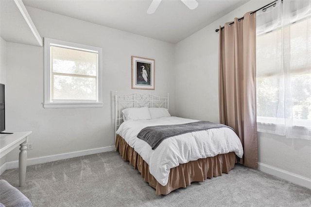 bedroom with light colored carpet and ceiling fan