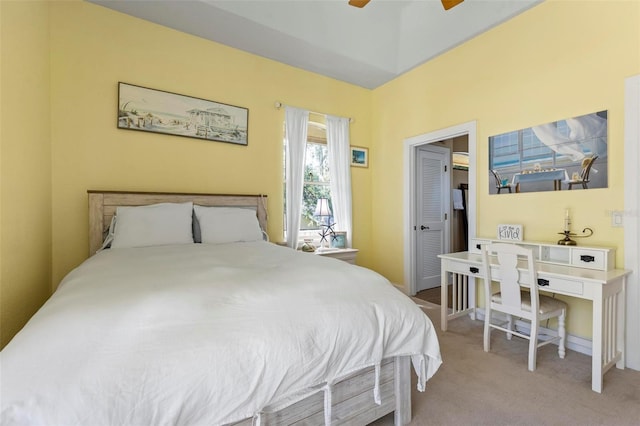 bedroom featuring light colored carpet and ceiling fan