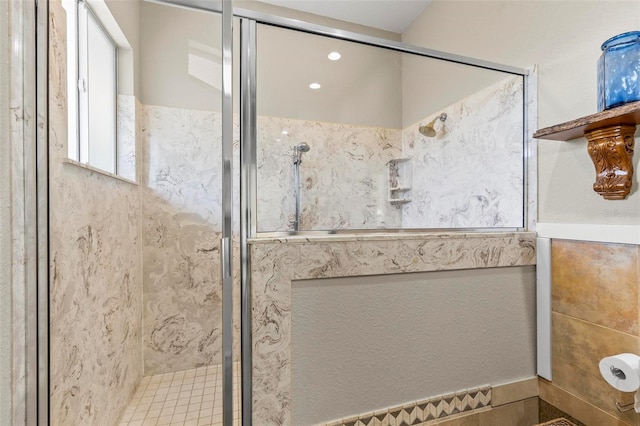 bathroom with a shower with shower door