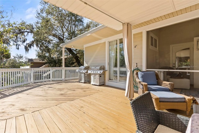 wooden deck with area for grilling