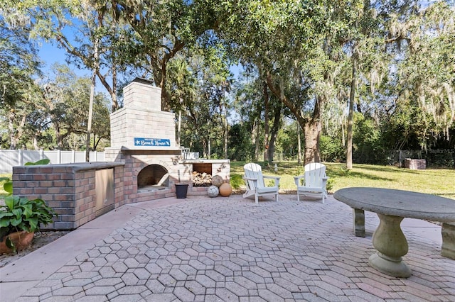 view of patio / terrace with exterior fireplace