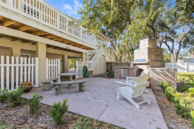 view of patio / terrace with an outdoor fireplace