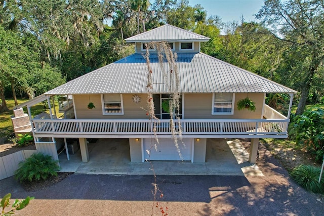 view of front of home featuring a porch and a garage