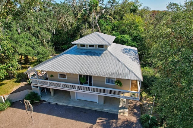 rear view of house with a garage