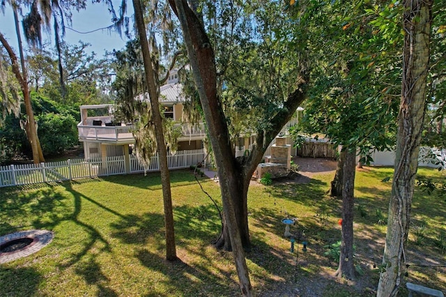 view of yard with a balcony