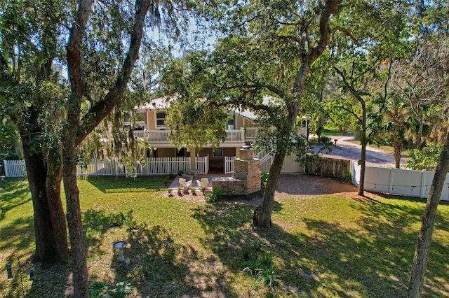 view of yard with a balcony