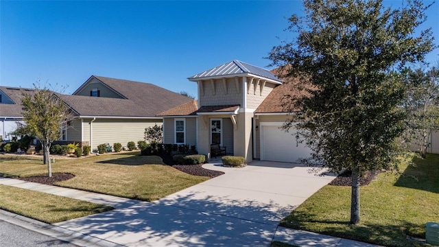 view of front of home with a garage and a front lawn