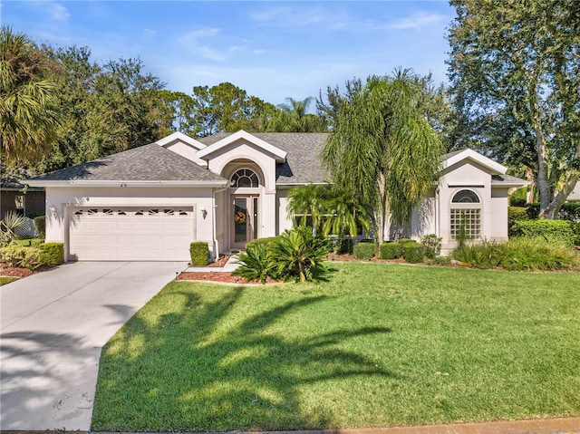 ranch-style house featuring a front yard and a garage