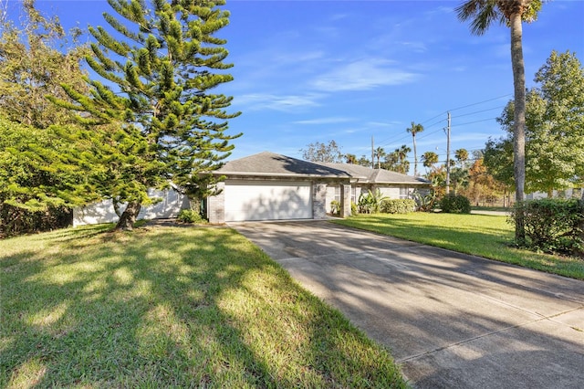 view of front of house featuring a front yard and a garage