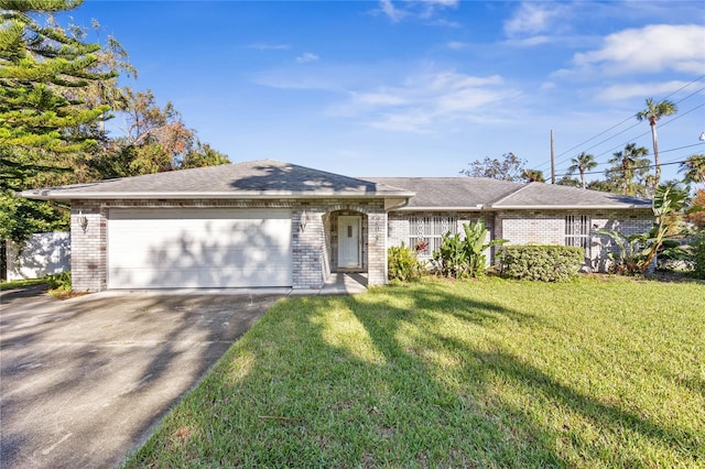 ranch-style house with a garage and a front lawn