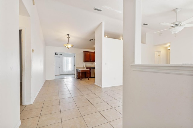 interior space with ceiling fan and light tile patterned floors