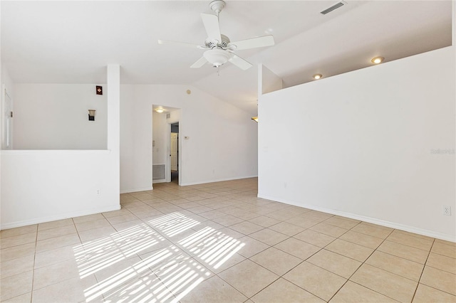 tiled spare room featuring lofted ceiling and ceiling fan