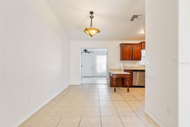 kitchen with dishwasher, ceiling fan, pendant lighting, and light tile patterned floors