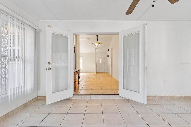 unfurnished room featuring french doors, ceiling fan, and light tile patterned floors