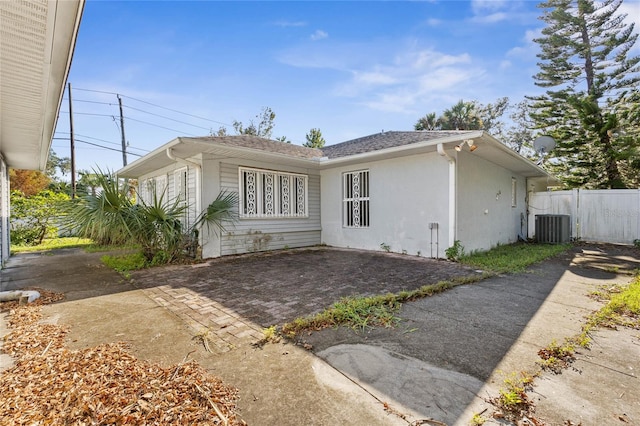 view of front of property featuring a patio area and central AC