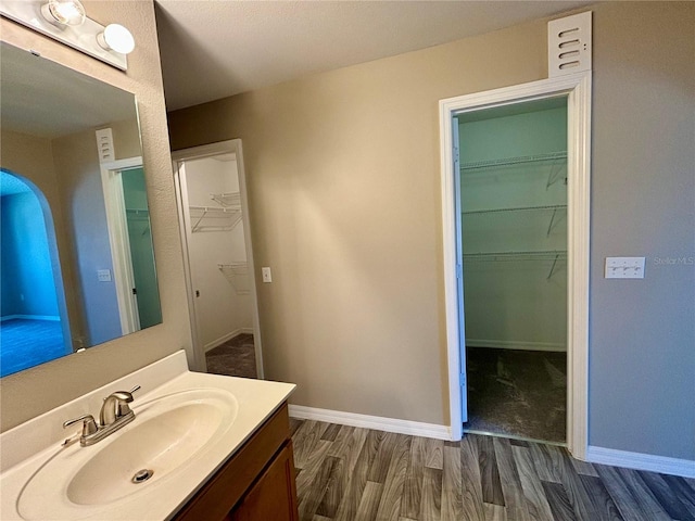 bathroom featuring vanity and hardwood / wood-style floors