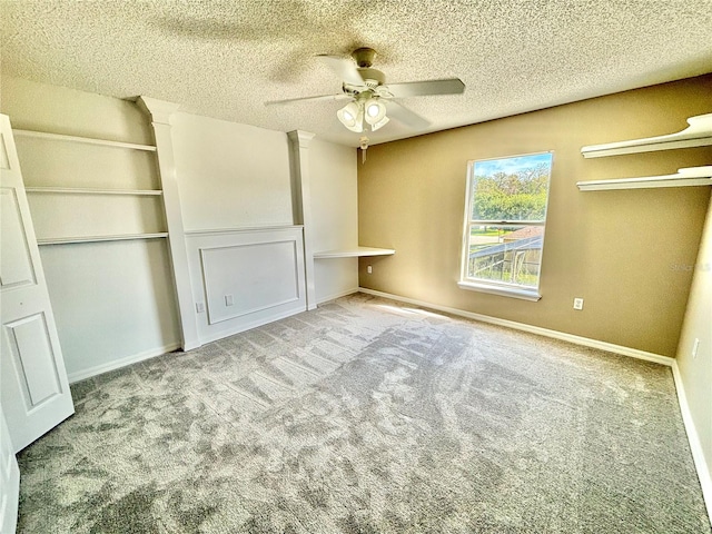 unfurnished bedroom featuring a closet, a textured ceiling, carpet flooring, and ceiling fan