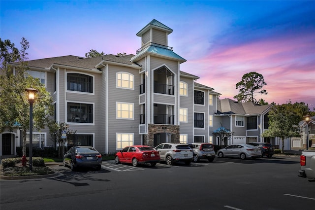 view of outdoor building at dusk