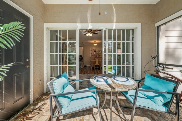 balcony featuring a patio and ceiling fan