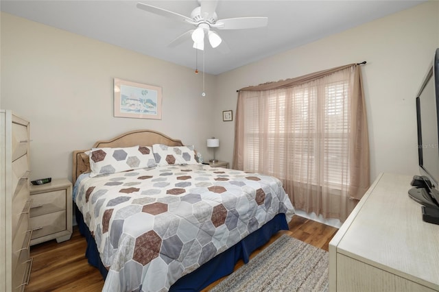 bedroom featuring hardwood / wood-style flooring and ceiling fan