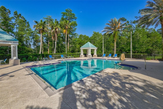 view of pool featuring a patio and a gazebo