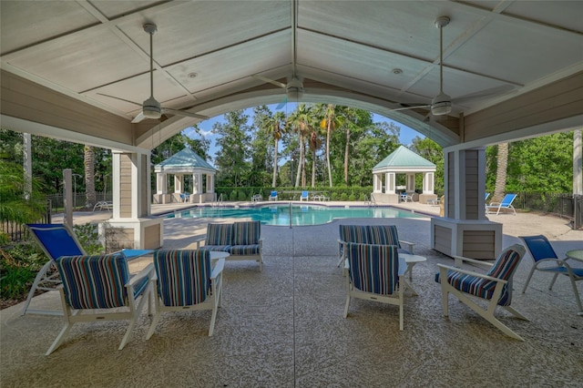 view of pool featuring a gazebo, ceiling fan, and a patio area