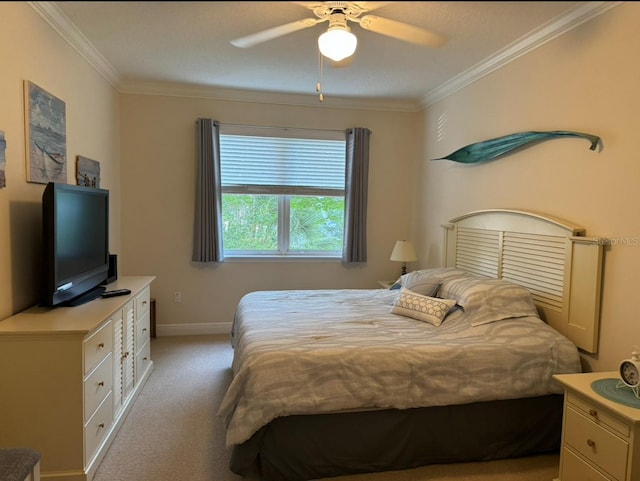 bedroom with crown molding, light colored carpet, and ceiling fan