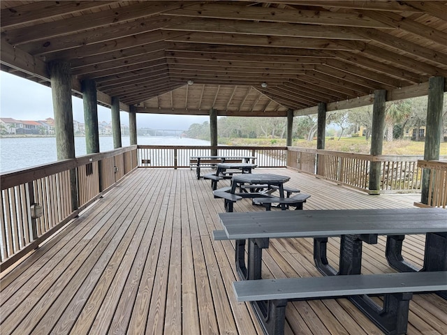 wooden terrace with a water view and a gazebo