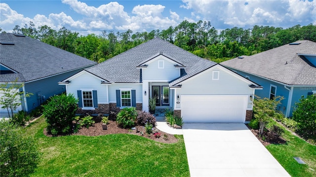 view of front facade featuring a garage and a front lawn