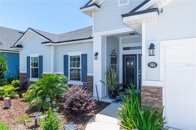 property entrance with a garage