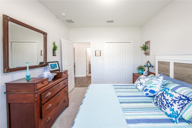 bedroom featuring light hardwood / wood-style flooring and a closet