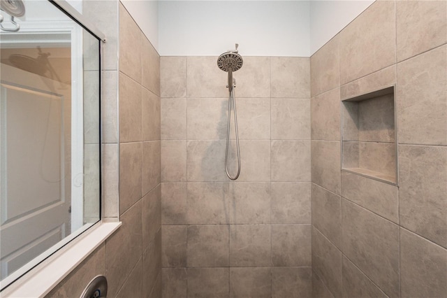 bathroom with a tile shower