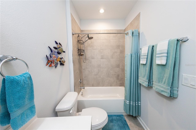 bathroom with shower / bath combo with shower curtain and toilet