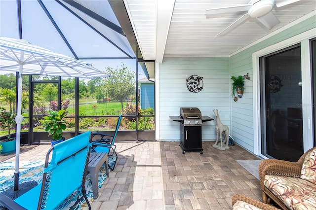 sunroom with beamed ceiling