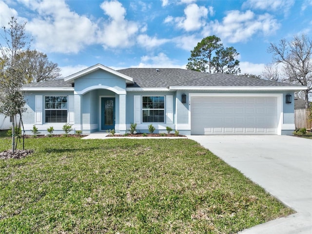 ranch-style home with a garage and a front yard