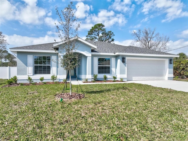 single story home with a garage and a front yard