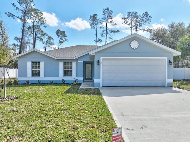 ranch-style home with a garage and a front lawn